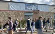 Milford students protesting with "We Want Urinals" sign
