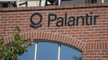 Palantir sign on a brick building