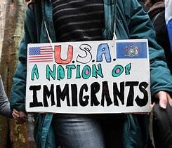 Sign reading "USA: A Nation of Immigrants"